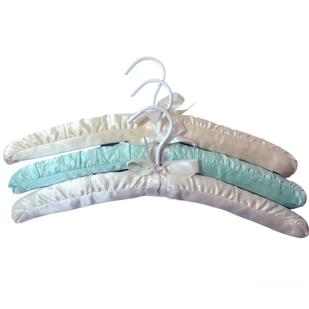 Three Luxurious Padded Satin Hangers-2 Cream and 1 Soft Blue Hanger.